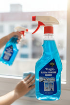 Blue spray bottle with a red nozzle on a white background