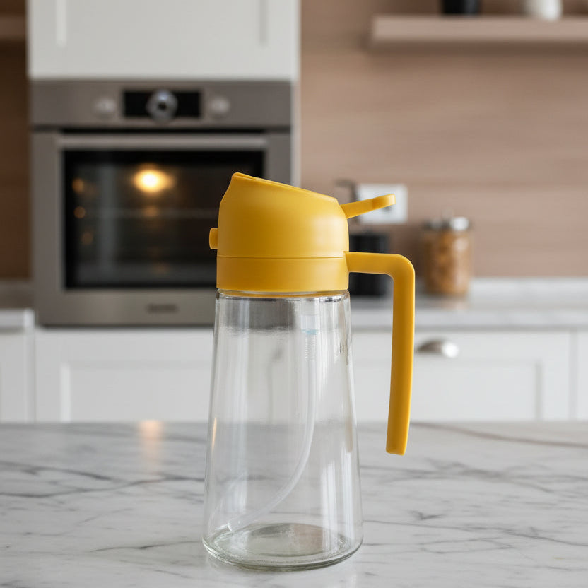 Clear glass bottle with yellow lid and handle on a textured gray background